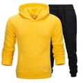 Sport-Set für Damen und Herren mit gelbem Kapuzenpullover und schwarzer Jogginghose - Gelb/Schwarz