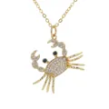 Goldene Krabben Anhängerkette mit weißen Kristallen und schwarzen Steineaugen - Weißer Zirkon