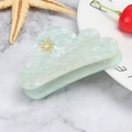 Detail of light green cloud hair claw with marble texture and golden sun patterns - Starry Light Blue Sun