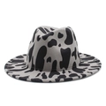 Jazz style fedora hat featuring a bold black and white cow print and wide flat brim - M (56-58cm) / Gray