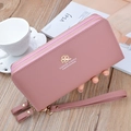 Dusty rose leather wristlet wallet with double zippers and lychee grain texture - Pink