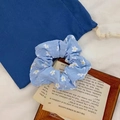 Light blue floral organza scrunchie with small white flowers on a vintage background - Blue With Camellia