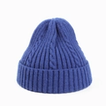 Detailed close-up of blue cable knit beanie with thick ribbed cuff and woven texture - Sapphire Blue