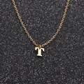 Macro view of gold stainless steel sweater chain with a capital T-letter pendant - Gold T