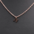 Close-up of rose gold stainless steel necklace featuring a minimalist letter N pendant - Rose Gold N