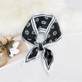 Elegant black and white silk scarf with lip print pattern and sleek white borders - Lips Black