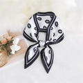 Elegant black and white lips print silk scarf tied neatly on a luxury prop background - Lips White