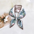 Narrow silk scarf with pink flamingo and green palm leaf patterns tied in a bow - Tropical Bird White
