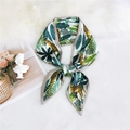 Narrow silk twilly scarf featuring yellow cheetah and tropical leaf print in a bow - Jungle Leopard White