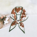 Narrow silk scarf with brown heart patterns and green edges on velvet background - Orange Heart Carriage Pattern
