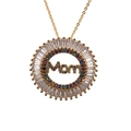 Macro shot of gold MOM pendant with baguette and colorful round cubic zirconia stones - MOM3 Round O-Chain / Gold