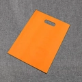 Orange PE plastic shopping bag with die-cut handle for clothing and gift packaging - Orange