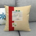 Beige linen square pillow cover featuring a white duck snow scene with a red decorative band - Style 15