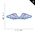 Pink and blue embroidered angel wings patch with size labels of 5.8cm by 1.5cm - Angel Wing