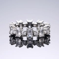 Detailed view of square and round cut cubic zirconia stones set in a silver ring band - US 9 / White Gold