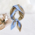 Pleated light blue and bronze silk scarf with geometric block patterns on white plush - Khaki Blue