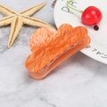 Detail of orange marble acrylic hair claw clip with gold glitter on marble background - Plain Orange