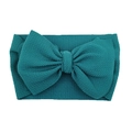 Macro shot of teal waffle knit fabric headband with a large decorative bow for infants - Peacock Blue