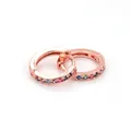 Macro shot of rose gold huggie hoop earrings with multi-colored rainbow cubic zirconia - Rose Gold - Multicolor Zircon