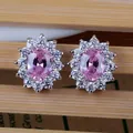 Macro detail of sunflower studs with pink oval zircon and sparkling white crystals - Stud Earrings / Pink