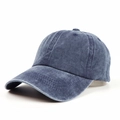 Close-up of deep blue washed denim fabric and six-panel stitching on baseball cap - Adjustable / Navy Blue
