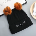 Cute black knit cat ear beanie with orange pom-poms and embroidered animal whiskers - Black