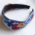 Close-up of floral embroidery on wide knotted headband with ethnic patterns - Standard Type / Sky Blue Base Flower