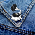 Gramophone enamel pin with galaxy theme and astronaut on a blue denim jacket - Space Gramophone