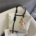 White large capacity tote bag with long black handles and a cute plush bear charm - With Bear / Beige