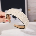 Elegant beige faux pearl headband with cream finish and soft black fabric lining - Style 1