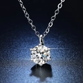 Macro shot of 1 carat moissanite pendant with classic six-prong setting on starry blue background - Q003 Six-Prong Classic 1ct