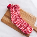 Winter plush coral fleece socks in red and white stripes with decorative pom-poms - One Size / Red