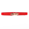 Elastic red waist belt for women with a detailed golden leaf buckle on white background - Red