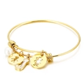Golden titanium bangle featuring a pearl, letter J pendant, and boy and girl silhouettes - Letter J / Gold