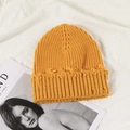 Bright yellow vintage knitted beanie with distressed hole design and retro street style detail - Yellow