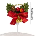 Christmas cake topper featuring green leaves, red berries, and red bow with bell, 5cm - Christmas Berry Holly Leaf Type B / Approx. 5cm
