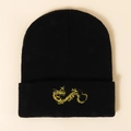 Detailed view of intricate gold dragon embroidery on a black knitted winter beanie cap - M (56-58cm) / Black