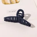 Detail of large navy blue matte hair claw clip with crossed teeth and metal spring - 11cm Cross - Matte Navy Blue