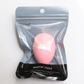 Pink teardrop makeup sponge in professional zipper packaging with hanging hole - Pink Slanted In Bag