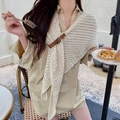Knitted off-white shawl poncho for women featuring a stylish brown leather buckle closure - Beige