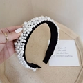Handheld view of a black baroque headband with densely set white pearls for brides - Black