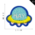 Cartoon UFO embroidery patch with HAY lettering in blue and yellow, 2.4x2.9 cm - UFO Spaceship
