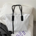 Minimalist white tote bag with black handles on a white pillow for daily commute - Without Pendant / White