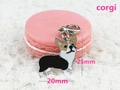 Macro view of a 20x25mm metal Corgi keychain pendant with colorful enamel details - Black Corgi