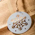White circular metal snowflake ornament with rustic hemp rope and star cutouts - Snowflake