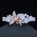 Golden hair clip with rhinestones and light blue flowers on a black background - 45# Four Small Flowers Blue