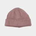 Detail of distressed knit texture and ripped holes on a pink street-style beanie hat - Dusty Pink