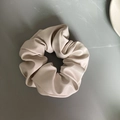 Detail of soft beige PU leather scrunchie showing premium texture and pleats - Large Size / Beige