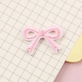 Pink embroidered bow patch with white edges for clothing iron-on or sewing applications - Macaron Pink