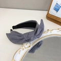 Elegant grey velvet headband with a stylish bunny ear bow knot on vintage mirror - Gray